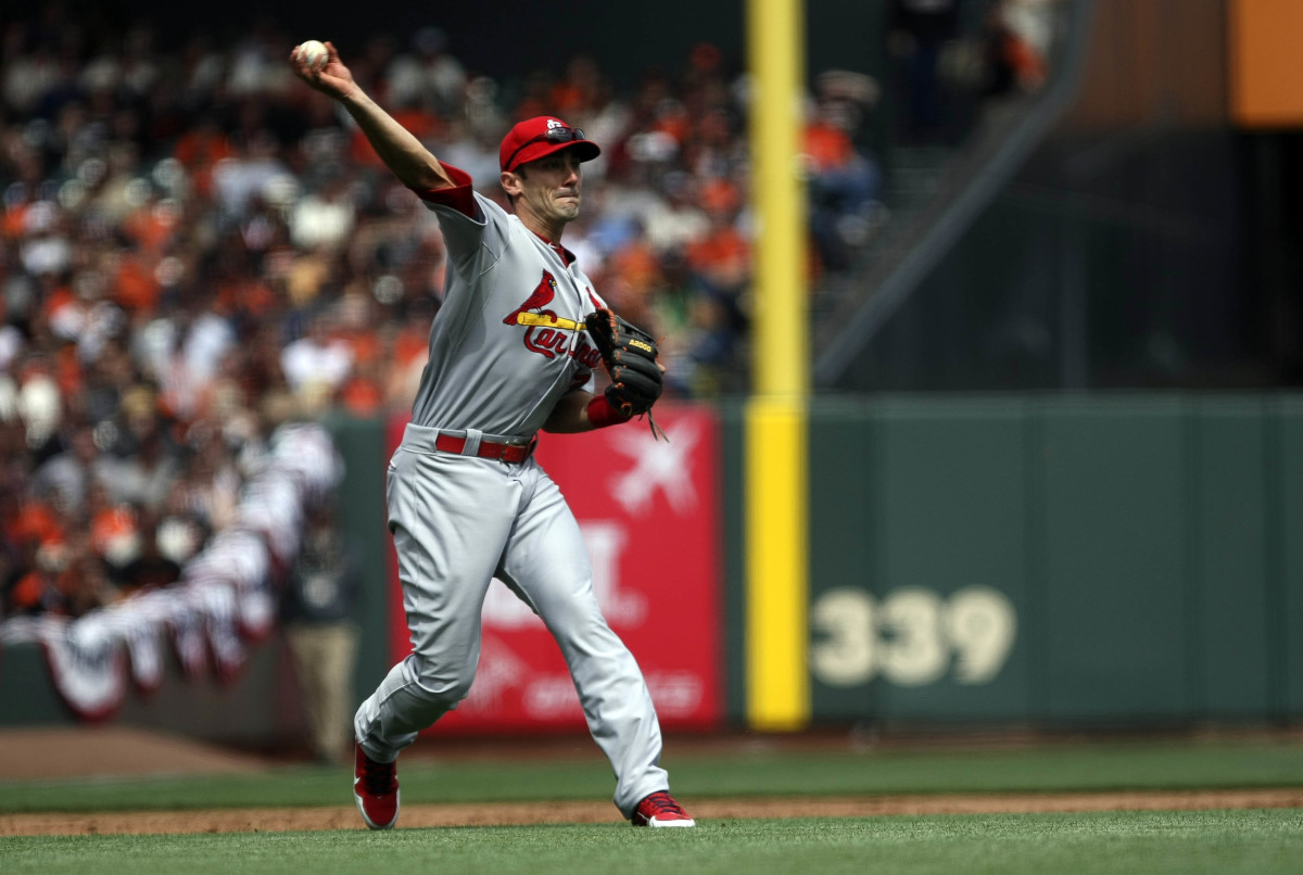 April 05, 2013; San Francisco, CA, USA; St. Louis Cardinals third baseman Matt Carpenter (13) throws the ball to first base against the San Francisco Giants during the third inning at AT&T Park. Mandatory Credit: Kelley L Cox-USA TODAY Sports  